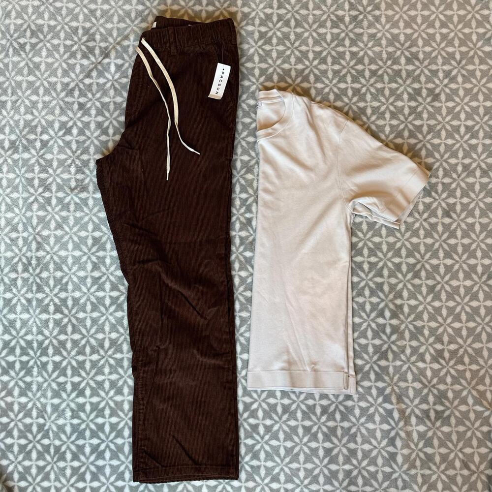 Brown corduroy trousers and cream t-shirt